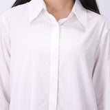 Side view of pinstripe button-down shirt in white