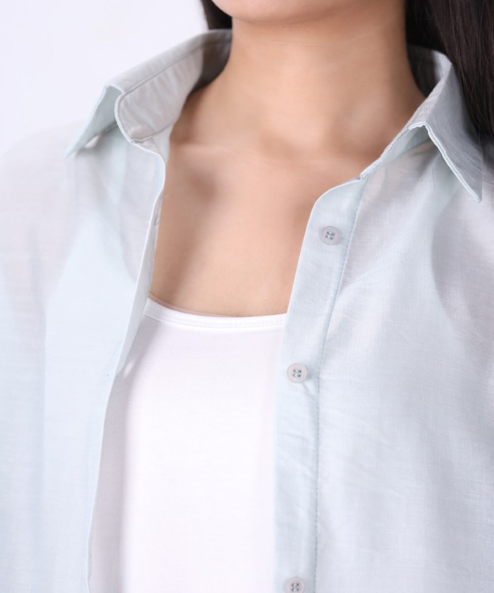 Side view of relaxed fit light blue shirt
