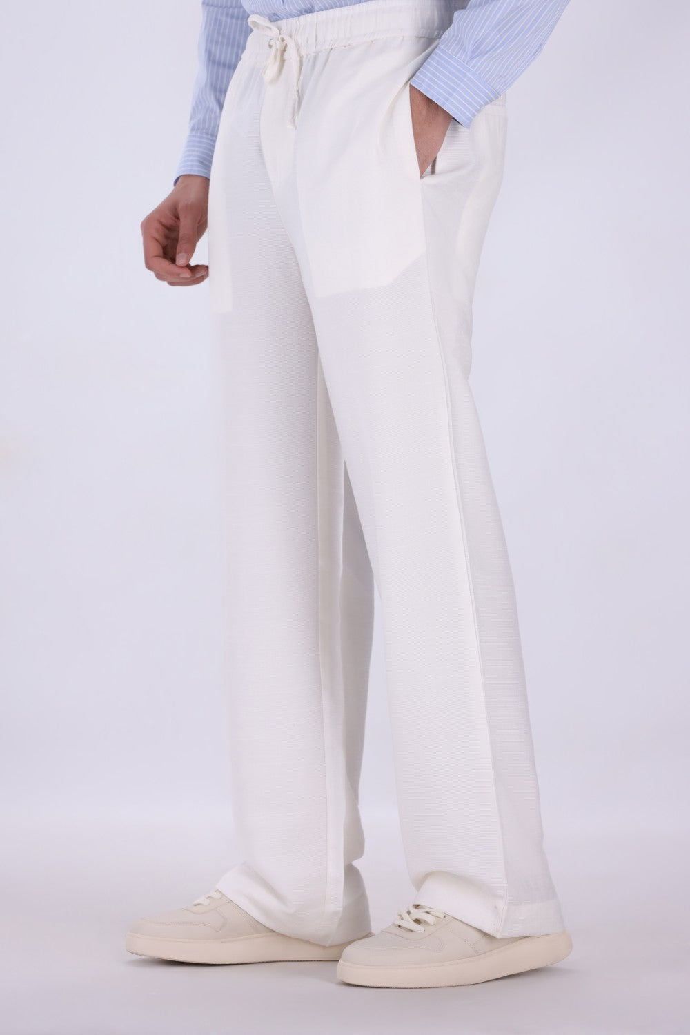 Side view of relaxed straight leg trousers
