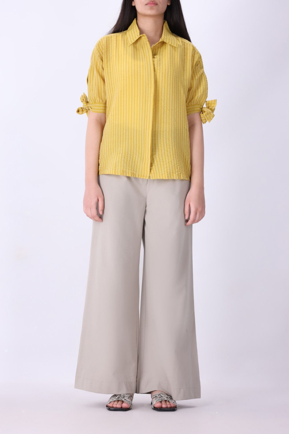 Side view of tie-sleeve button-down shirt
