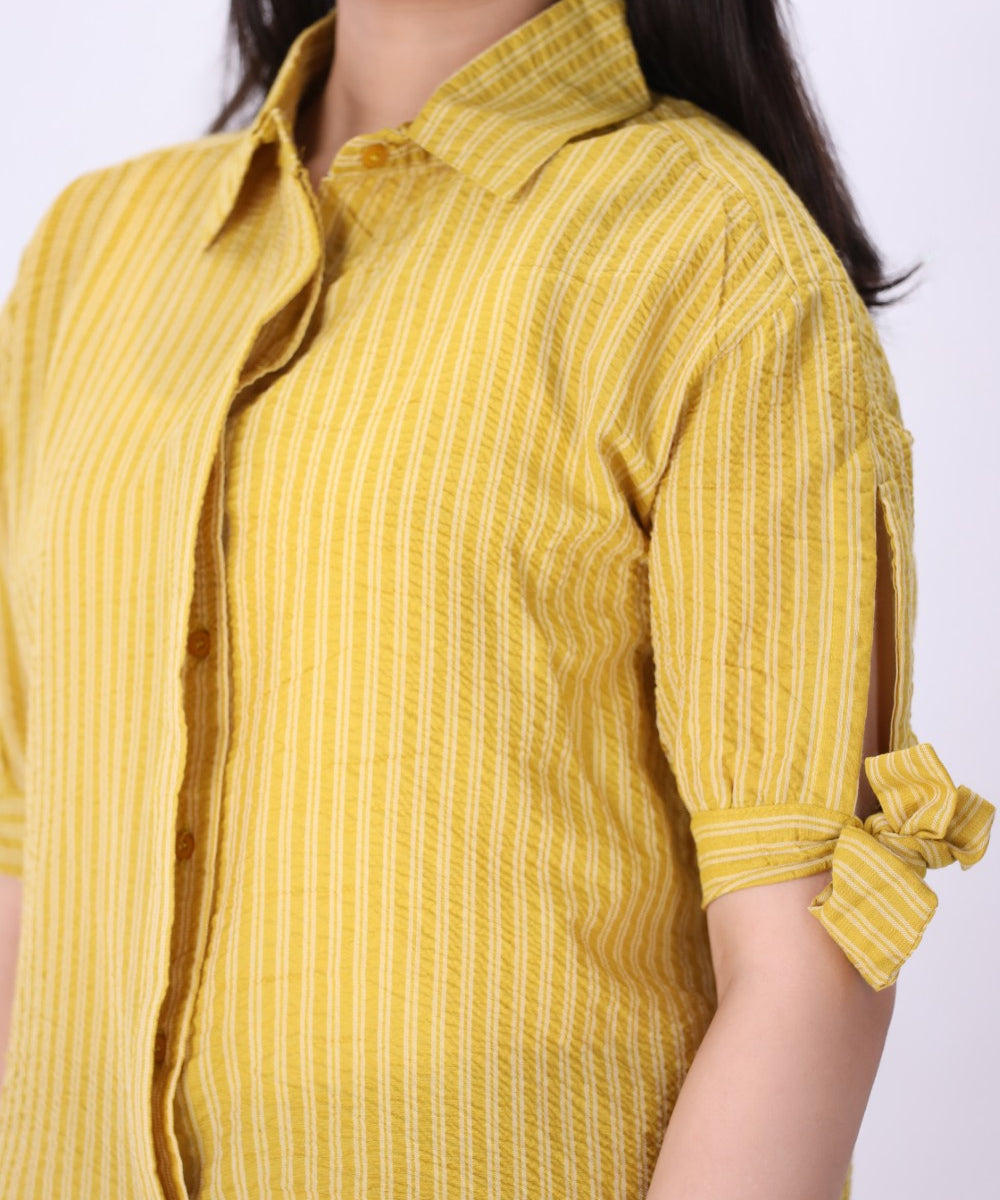 Striped summer shirt worn with white trousers
