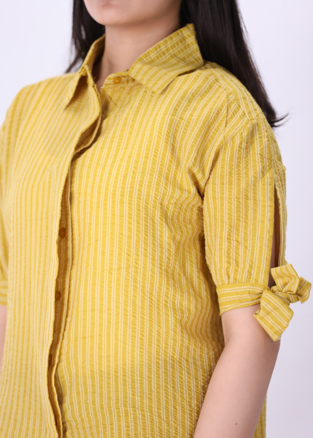 Striped summer shirt worn with white trousers
