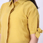 Striped summer shirt worn with white trousers
