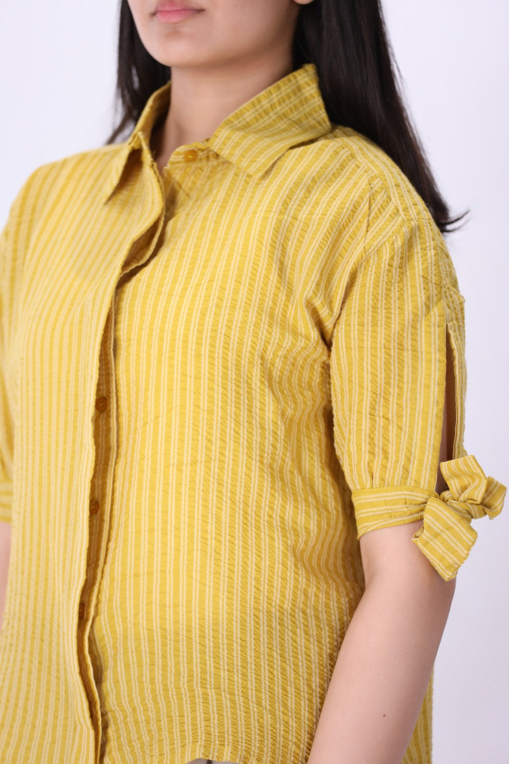 Striped summer shirt worn with white trousers
