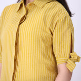 Striped summer shirt worn with white trousers
