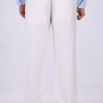 White pull-on trousers worn with loafers
