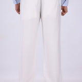 White pull-on trousers worn with loafers
