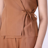 Wrap vest layered over a fitted tee
