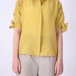 Yellow striped shirt styled with denim
