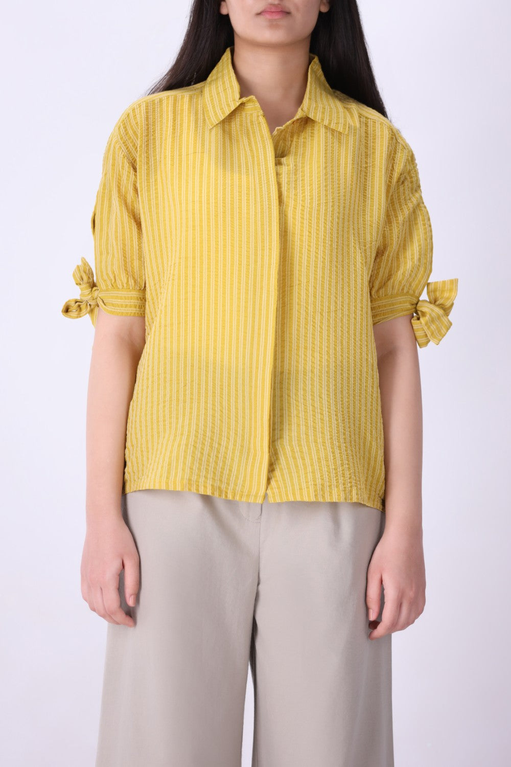 Yellow striped shirt styled with denim
