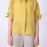Yellow striped shirt styled with denim
